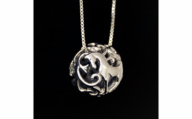 Photograph of sterling silver filigree horse necklace