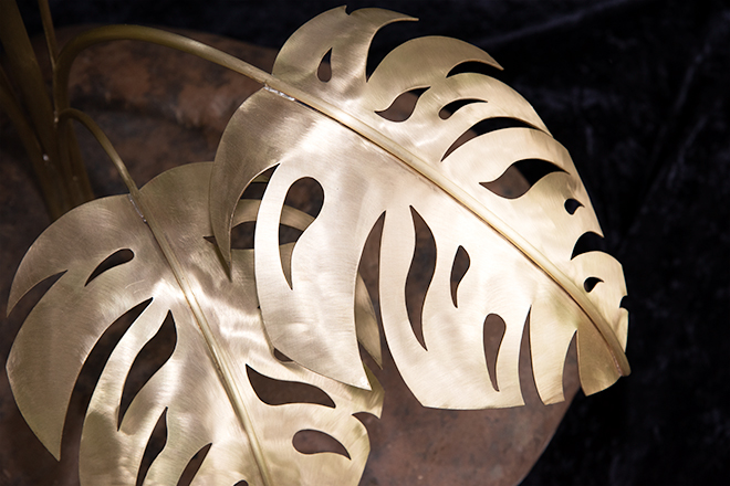 Brass leaves on a flower sculpture by Jeni Benos