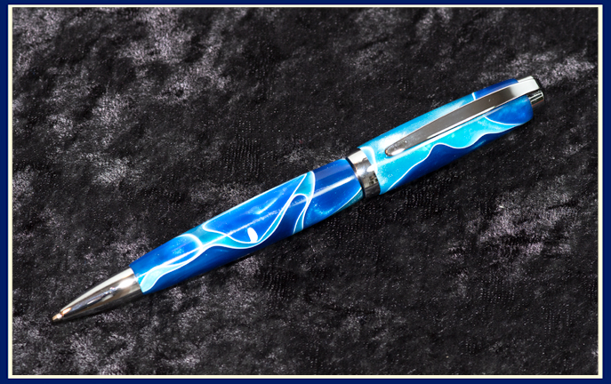 blue acrylic pen with light and dark blue swirls