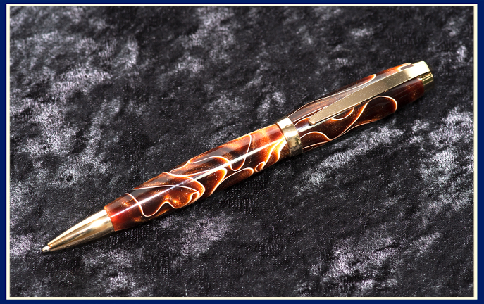 Hand turned pen in brown and gold acrylic by Phil Benos