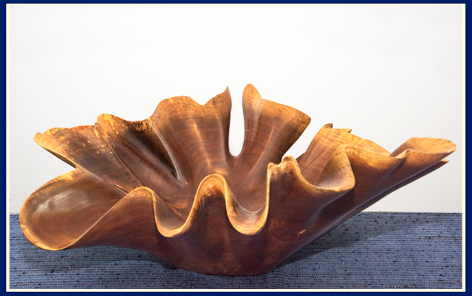 wooden carving in black walnut by with dramatic wavy edge