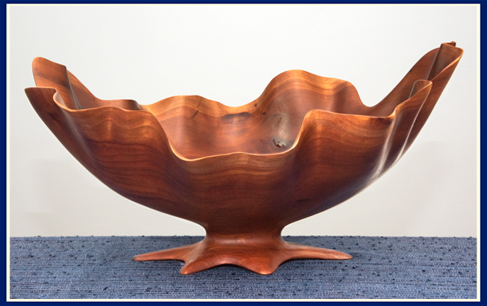 cherry wooden bowl with a wavy edge crafted by Bruce Fransen