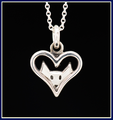 sterling silver necklace with a cat looking through an open heart