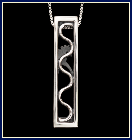 Serpentine in a rectangular frame on a four sided necklace