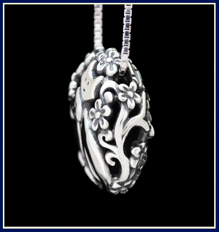 Cat bead filigree necklace in sterling silver by Jeni Benos side view