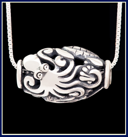 Bead necklace with octopus holding sea shell by Jeni Benos