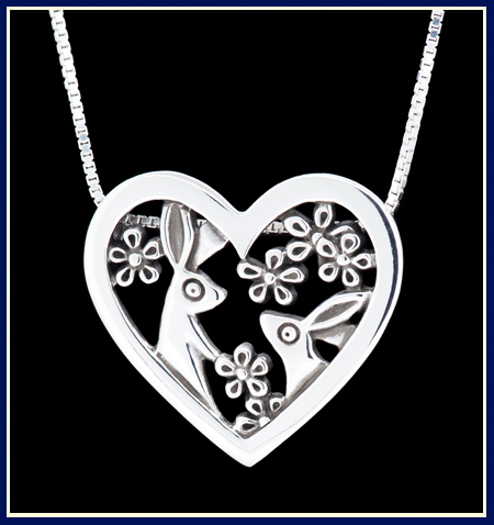 Sterling silver necklace with rabbits and daisies in a heart